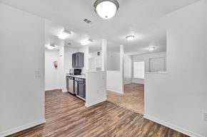 Myrtle Beach apartment for rent - A kitchen area with a dishwasher and a microwave.