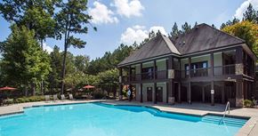 Norcross apartment for rent - a large swimming pool in front of a house