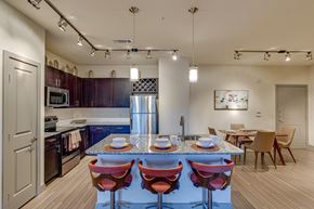Grand Prairie apartment for rent - a kitchen and dining room with a table and chairs