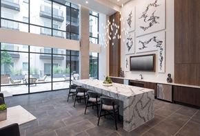 Dallas apartment for rent - a large dining room with a marble table and chairs