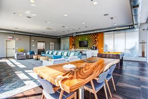 Chicago apartment for rent - a living room and dining room with a wooden table