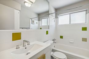 Dallas apartment for rent - a bathroom with a sink and a toilet and a bath tub