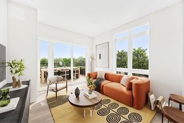 Brighton apartment for rent - A living room with a brown sofa and a coffee table.