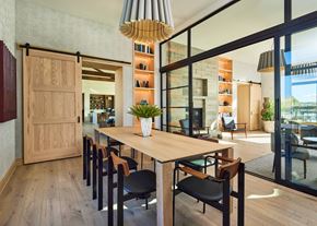 Aurora apartment for rent - a dining room with a wooden table and black chairs