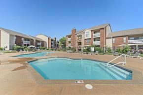 Mission apartment for rent - A swimming pool in front of apartment buildings.