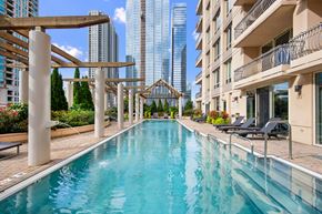 Chicago apartment for rent - a swimming pool with a city skyline in the background