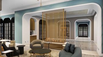 Chicago apartment for rent - A living room with a grey sofa and a round table.