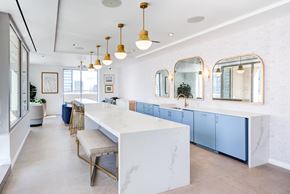 Chicago apartment for rent - a large kitchen with blue cabinets and a white counter top