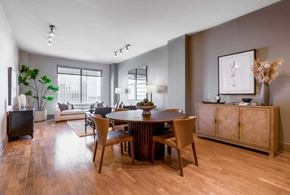 Houston apartment for rent - A dining room with a wooden table and chairs.