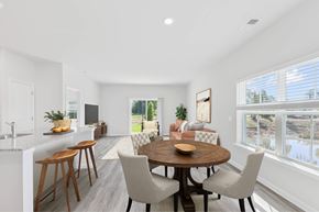 Pooler apartment for rent - a living room and dining room with a table and chairs