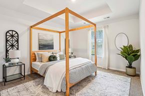 Pooler apartment for rent - a bedroom with a canopy bed and a window
