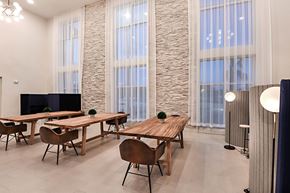 Pensacola apartment for rent - a conference room with tables and chairs and large windows