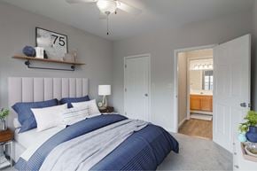 Haverhill apartment for rent - a blue and white bedroom with a large bed