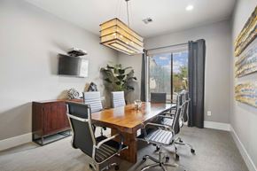 San Antonio apartment for rent - a conference room with a wooden table and chairs and a window