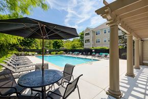 Salem apartment for rent - our apartments have a large pool and patio with chairs and umbrellas