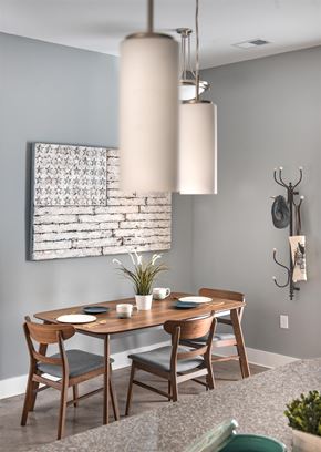 Myrtle Beach apartment for rent - a dining room with a table and chairs and a painting on the wall