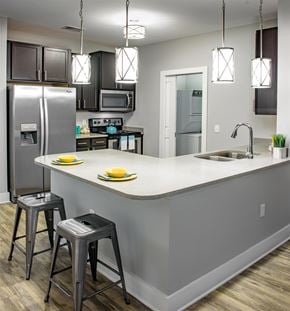 Myrtle Beach apartment for rent - a kitchen with a large island and stainless steel appliances
