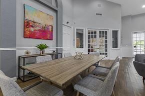 Delray Beach apartment for rent - a dining room with a wooden table and chairs