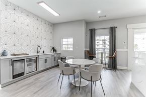 Gainsville apartment for rent - A modern kitchen with a dining table and chairs.