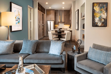 Plano apartment for rent - A living room with a grey couch and a coffee table.