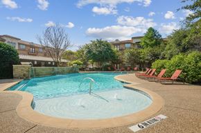 Mansfield apartment for rent - A pool with a fountain in the middle of it.