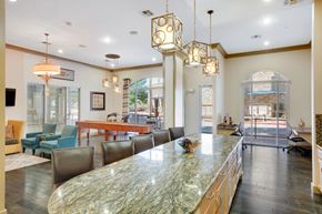 Mansfield apartment for rent - A large, well-lit dining room with a marble table and chairs.