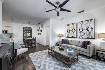 Orlando apartment for rent - A modern living room with a grey sofa and a coffee table.