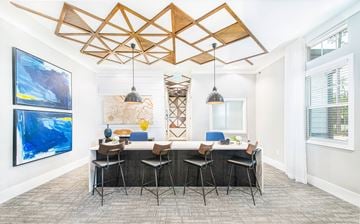 Savannah apartment for rent - A modern kitchen with a large island and a dining table with chairs.