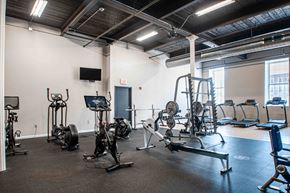 Cohoes apartment for rent - A gym with a variety of exercise equipment including treadmills, stationary bikes, and weight machines.