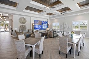 Fort Myers apartment for rent - A large dining room with a long table and chairs.