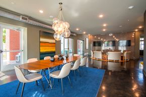 Columbia apartment for rent - A dining room with a wooden table and white chairs.