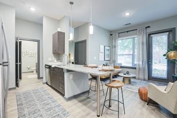 Columbia apartment for rent - A modern kitchen with a dining table and chairs.