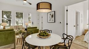 Denton apartment for rent - a dining room table with a basket of fruit on it