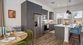 Denton apartment for rent - a kitchen and dining area with a stainless steel refrigerator