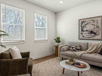Madison apartment for rent - A living room with a couch, chair, and a painting on the wall.
