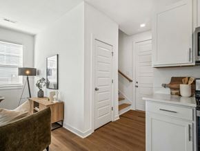 Madison apartment for rent - A kitchen with white cabinets and a wooden floor.