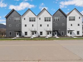 Chattanooga apartment for rent - A row of houses with grey and white exteriors.