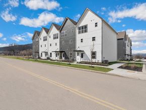 Chattanooga apartment for rent - A row of modern houses with grey and white exteriors.