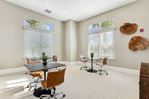 Palm Bay apartment for rent - A conference room with a table, chairs, and a plant.