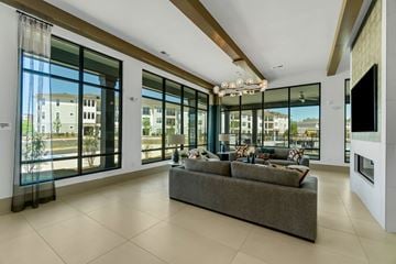 Charlotte apartment for rent - a living room with large windows and a couch