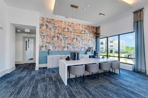 Charlotte apartment for rent - a conference room with a table and chairs and a large window