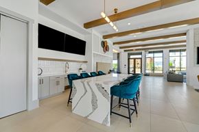 Charlotte apartment for rent - a large kitchen with a long island with blue chairs