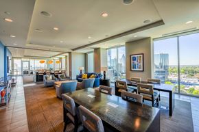 Atlanta apartment for rent - A modern dining room with a view of the city.