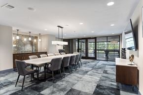 Huntsville apartment for rent - A modern dining room with a large table and chairs.