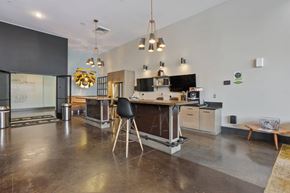Nashville apartment for rent - A modern kitchen with a black chair and a black table.