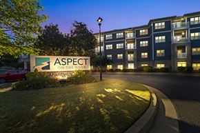 Canton apartment for rent - A sign for Aspect on the River Apartments is shown in front of a building.