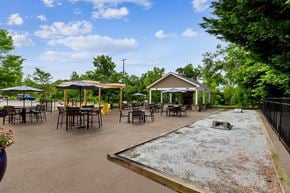 Canton apartment for rent - A playground with a slide and picnic tables.