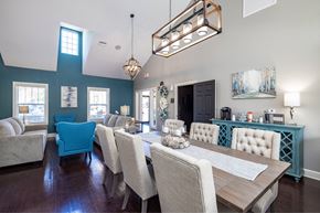 Lakeland apartment for rent - A dining room with a long table and chairs.