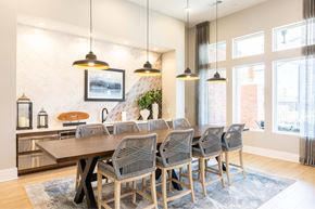 Gainesville apartment for rent - A modern dining room with a large table and chairs.