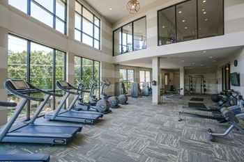 Multi-level fitness center with technogym equipment
